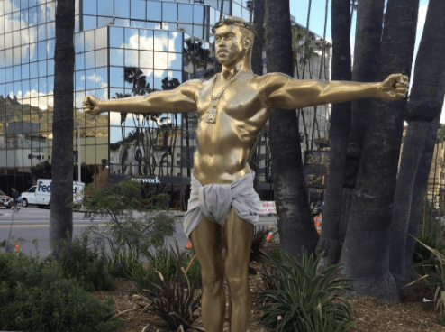 A life-size gold sculpture of Kanye West as Jesus has appeared in Hollywood