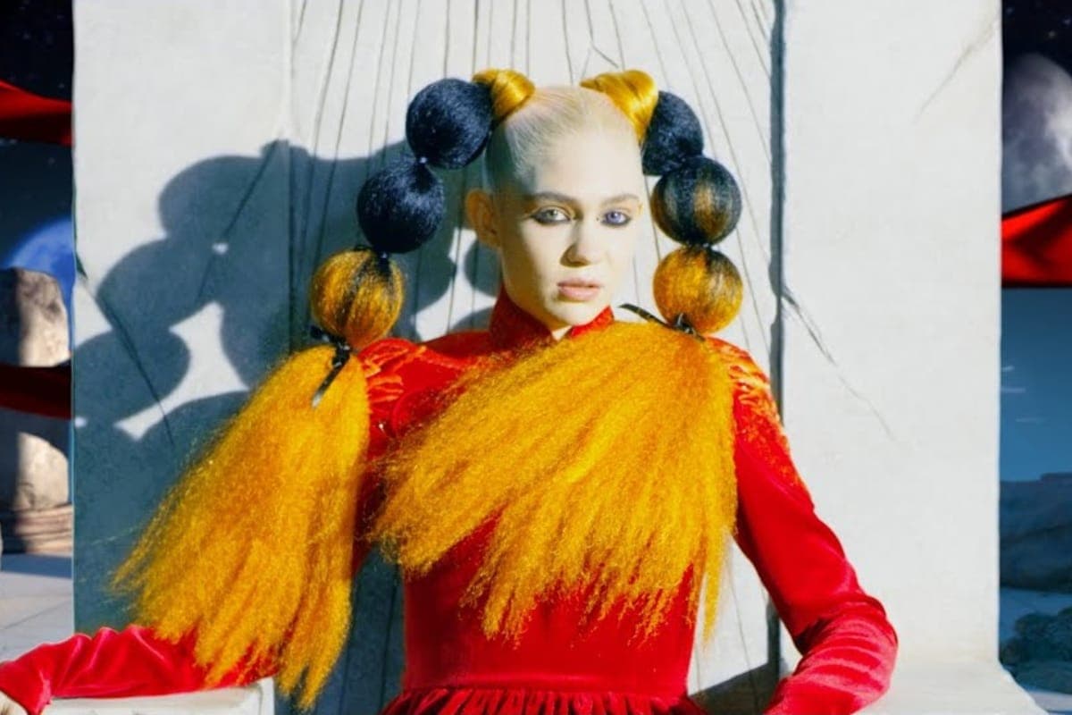 Grimes sits atop a crumbled empire in new ‘Delete Forever’ video