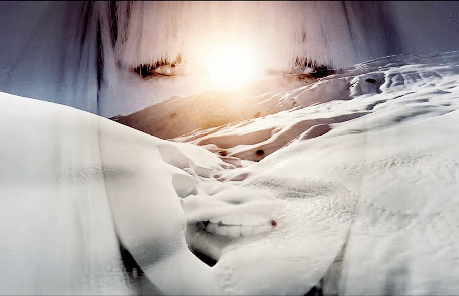 EMA layers herself over snowy landscapes in 'Amnesia Haze' video