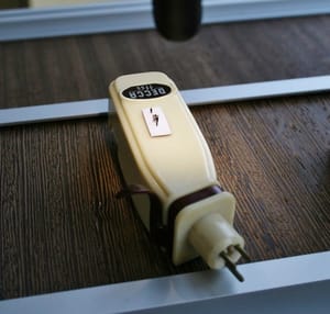 This microscopic turntable fits on the back of a stylus cartridge